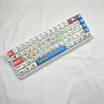 Vibrant Pokemon PBT MOA dye-sub keycap set, displayed from a unique angle. Highlights smooth MOA profile and nostalgic character designs for mechanical keyboard.