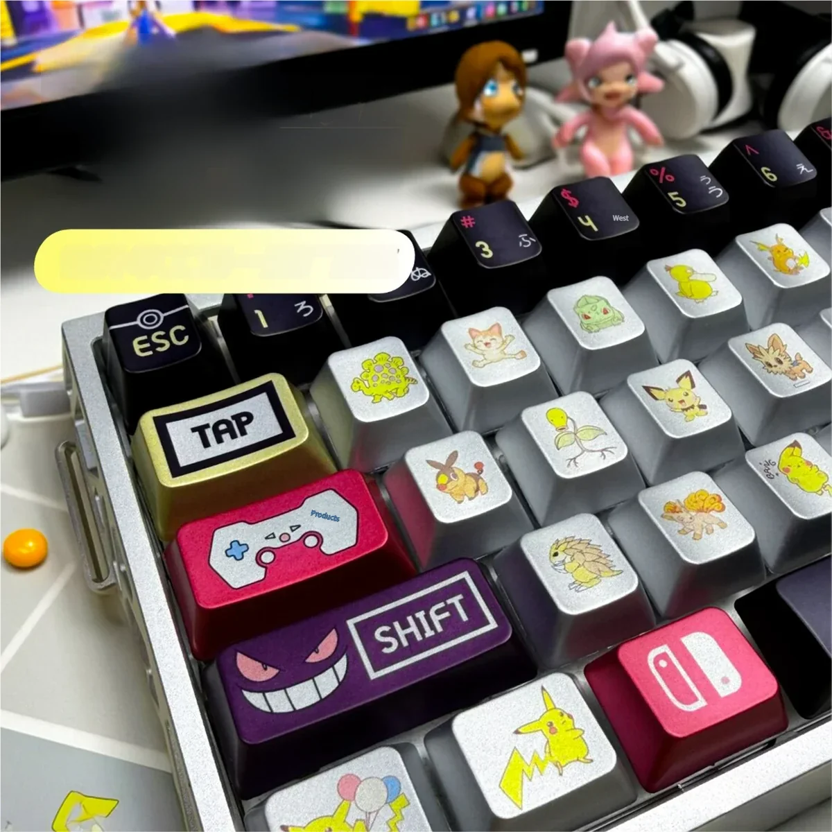 Close-up of a vibrant, premium metallic Pokemon artisan keycap set from multiple angles, showcasing its sleek finish and playful collectible design.
