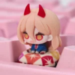 A dynamic, intricately sculpted Handcrafted Power Chainsaw Man Resin Keycap, showing its vibrant anime character art and fine details from a unique perspective view.