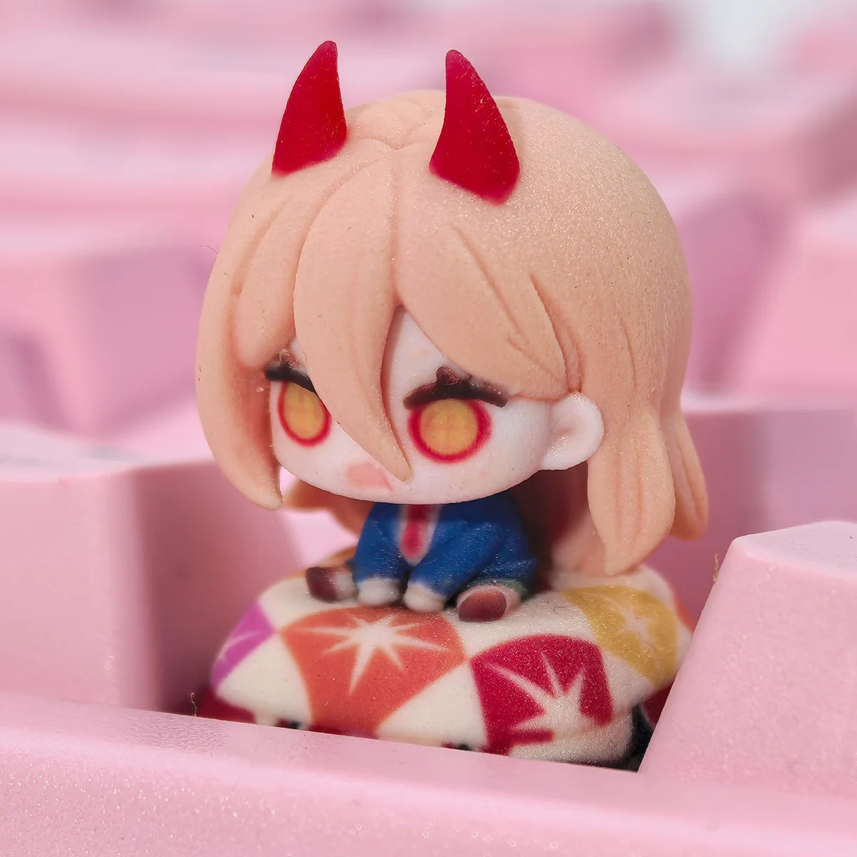 Experience the vibrant artistry of this Handcrafted Power Chainsaw Man Resin Keycap, an intricately sculpted anime Power Keycap for your keyboard.