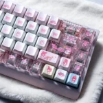 Whimsical My Melody PBT backlit dye-sub keycap set, showcasing iconic pastel pink designs and translucent legends from multiple angles.