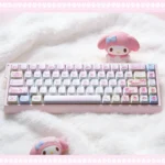 Iconic My Melody PBT backlit dye-sub keycap set, shown from multiple angles, highlighting whimsical pastel pink designs and translucent legends.