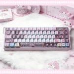 Iconic My Melody PBT backlit dye-sub keycaps set, showcasing whimsical pastel pink designs and translucent legends for a playful, custom keyboard look.