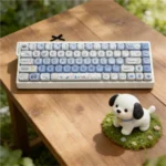 Whimsical Puppy Bagel PBT MOA keycaps set from various angles, with unique puppy and bagel illustrations in soft colors. Durable 108-key set.