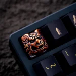 Pure copper Qilin keycap, an artisan fortune charm, showcased from multiple angles, highlighting its intricate mythical sculpture and brilliant metallic finish.