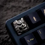 Pure copper Qilin keycap, a fortune charm, showcasing its intricate mythical sculpture and metallic luster from various angles.