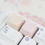 Adorable handcrafted resin bear artisan keycap for ESC key, showcased from a charming side angle with its playful pastel details.