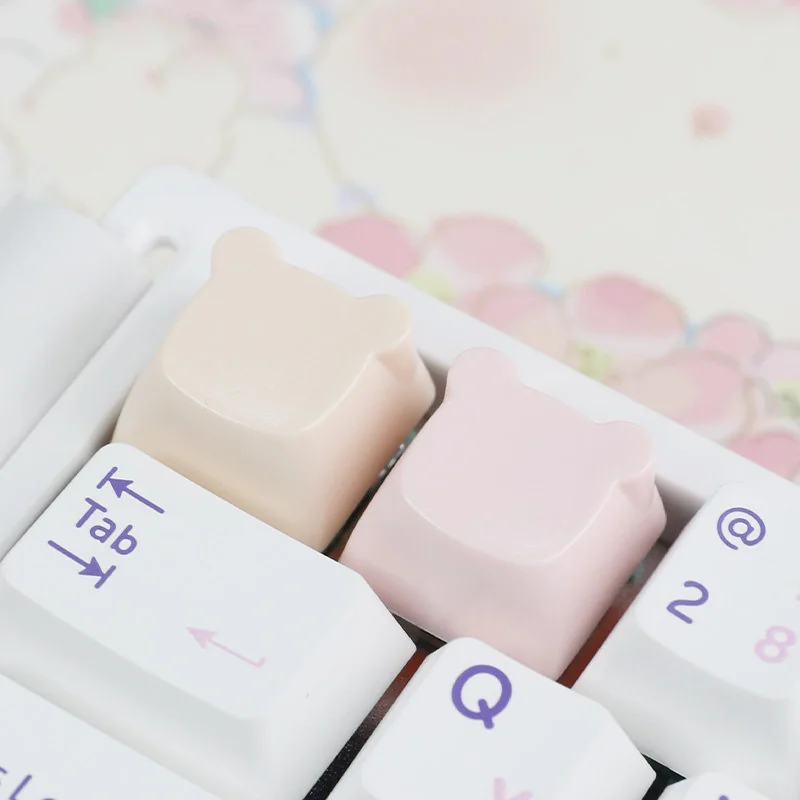 Adorable handcrafted resin bear artisan keycap for ESC key, showcased from a charming side angle with its playful pastel details.