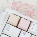 Detailed view of an adorable handcrafted resin bear keycap, designed for the ESC key, with its whimsical pastel colors and custom artistry.