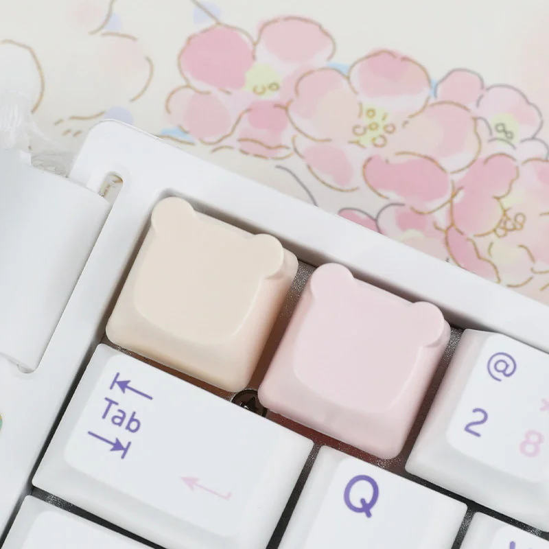 Detailed view of an adorable handcrafted resin bear keycap, designed for the ESC key, with its whimsical pastel colors and custom artistry.