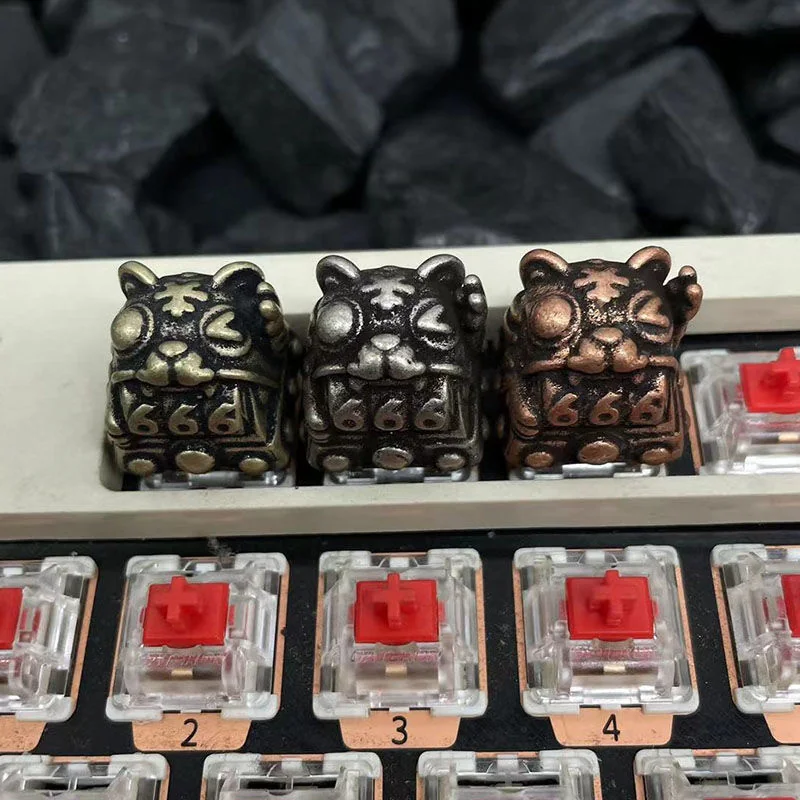 Premium handcrafted Retro Fortune Cat Keycaps, intricately sculpted from metallic finish, captured from a detailed side profile to highlight its exquisite craftsmanship.
