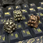 Close-up views of a premium handcrafted Retro Fortune Cat Keycaps, showcasing its intricate details and choice of polished or aged finishes.