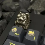 Detailed close-up of a premium handcrafted Retro Fortune Cat Keycaps, highlighting its intricate design and polished finish, symbolizing good design.