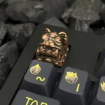 Premium handcrafted Retro Fortune Cat Keycaps from a side angle, highlighting the intricately sculpted metallic and choice of polished or aged finishes.