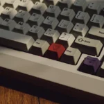 Retro Russian keycaps set, vintage PBT, displaying hollow R2 legends and a crisp, sculpted profile from multiple angles. Premium classic aesthetics.