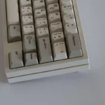 Close-up of premium SAW Retro PBT keycaps set, highlighting the sculpted vintage profile and clean aesthetic from a distinct angle.