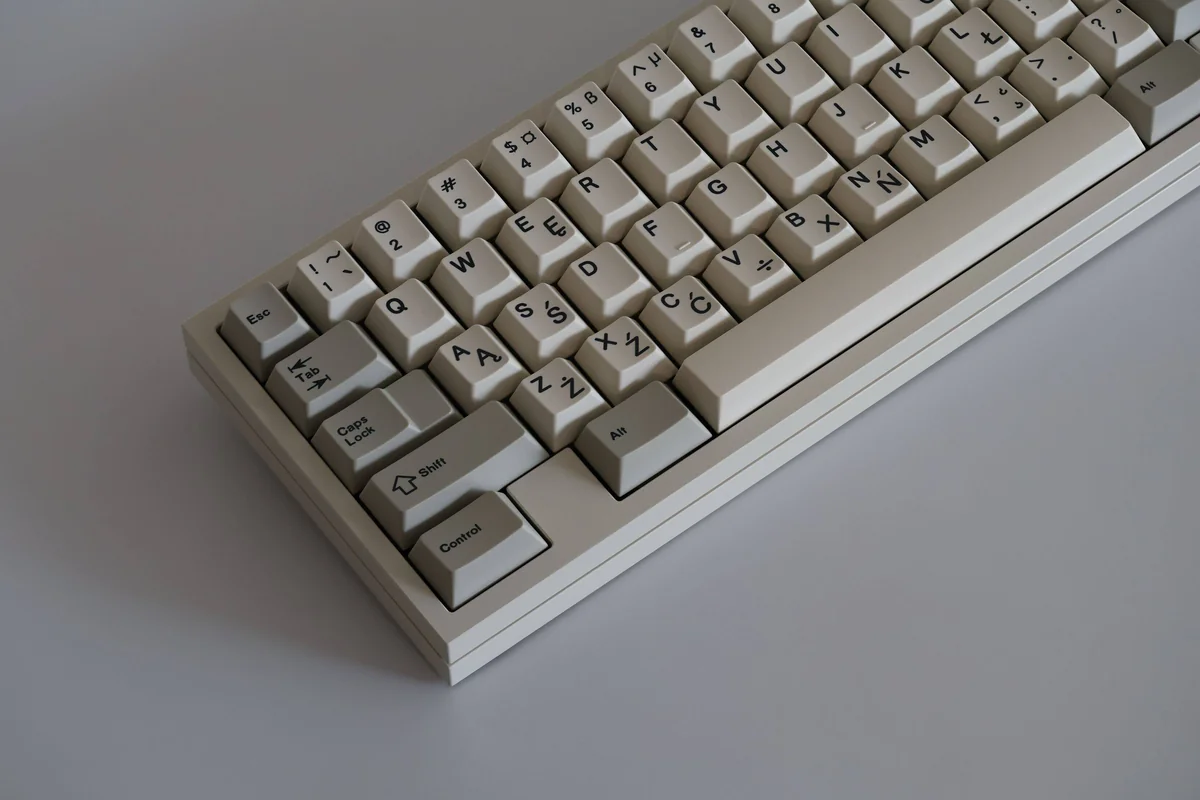 SAW Retro PBT Keycaps set, showcasing premium sculpted vintage keycaps in a clean palette, perfect for a classic computing aesthetic.