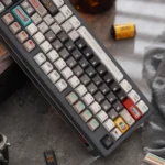 Close-up of retro synthesizer keycaps set, showcasing their distinct vintage synth design and vibrant colors, compatible with various keyboards for an artistic angle.