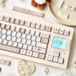 A playful gallery showcasing the charming pixelated Rilakkuma PBT Dye-Sub Keycap Set from various angles, highlighting its whimsical characters charm.