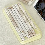 A whimsical set of Pixel Rilakkuma PBT Dye-Sub keycaps set, showcasing various angles of the charming pixel art characters for a cozy, nostalgic keyboard.