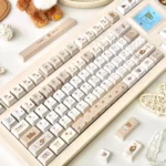 Whimsical Pixel Rilakkuma PBT dye-sub keycaps set on a mechanical keyboard, showcasing charming pixel art of Rilakkuma and Kaoru for a playful, nostalgic design.