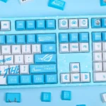 Detailed view of the Republic of Gamers: Se7en White Version Keycap Set, showcasing the PBT and intricate anime warrior princess design.