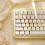 Romance Until Death PBT dye-sublimated 145-keycap set displayed from various angles, showcasing dreamy pink, blue, and yellow hues for an artistic, serenity design.