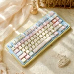 Romance Until Death PBT Dye-Sublimated Keycap Set from multiple angles, showcasing dreamy pink, blue, and yellow hues for an artistic, serene keyboard.