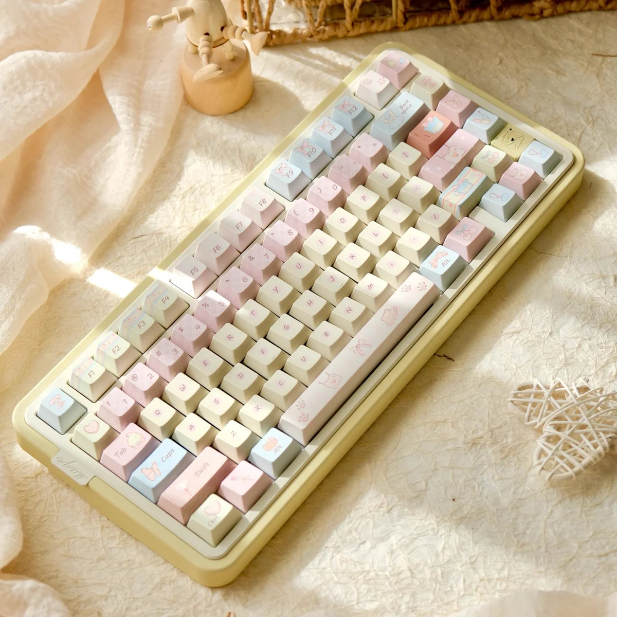Romance Until Death PBT Dye-Sublimated Keycap Set showcasing a full keyboard with dreamy pink, blue, and yellow hues, evoking gentle serenity.