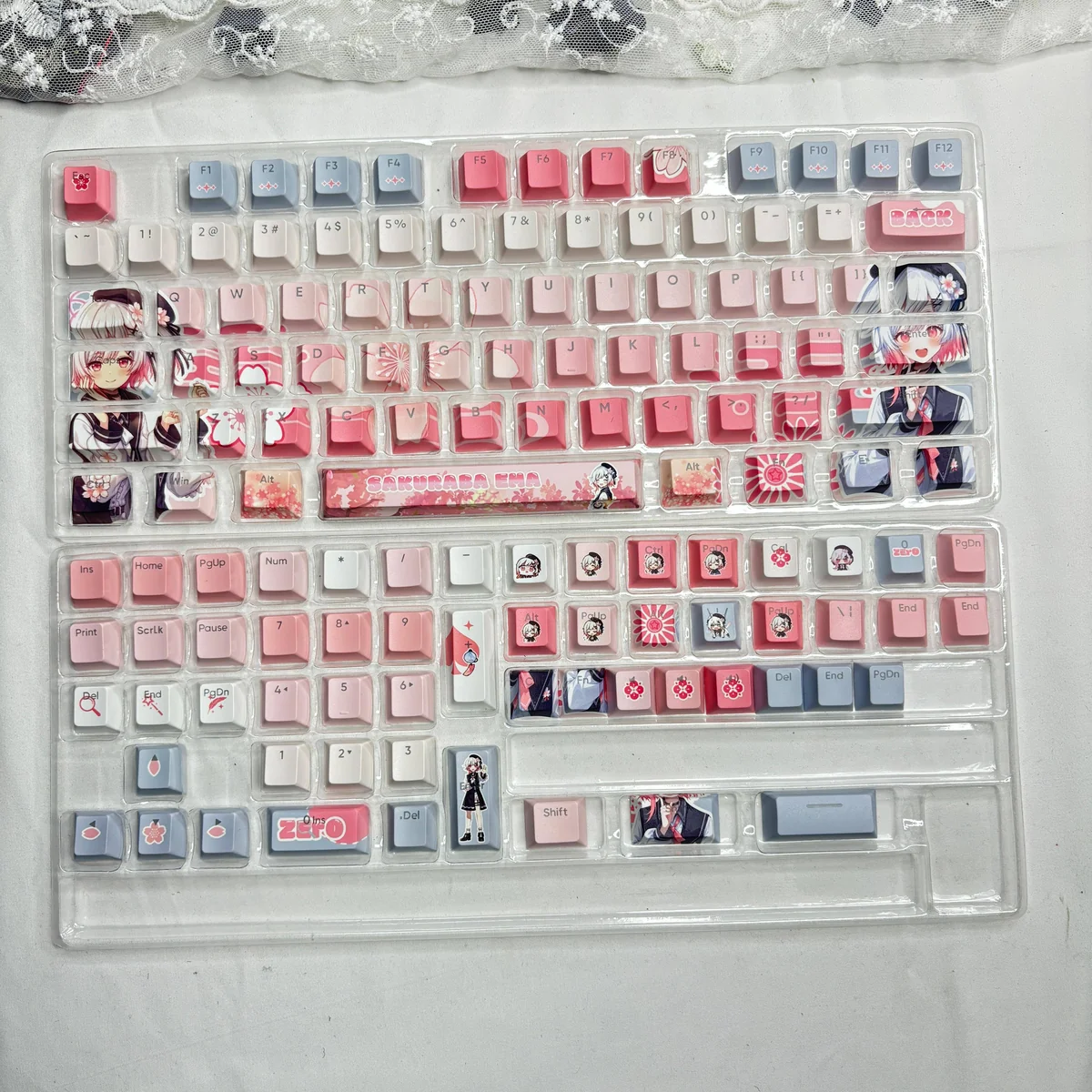 Close-up of the exclusive Sakuraba Ema Magical Girl Dye-Sub PBT keycaps set, showcasing the vibrant anime art and mystical witch trial aesthetic on a keyboard.