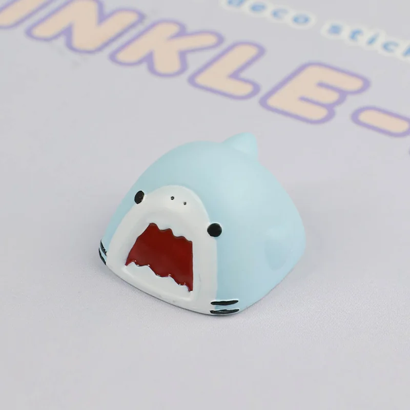 Close-up of a whimsical handcrafted Samezu shark artisan keycap, showcasing its unique details and playful cartoon design from a different angle.