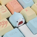 Detailed view of a charming handcrafted Samezu shark artisan ESC keycap, highlighting its whimsical marine design and unique artistry.