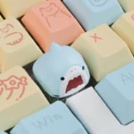 Playful handcrafted Samezu shark artisan keycap, showcasing its whimsical marine design from a unique angle. A cute, high-quality ESC key.