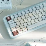 Artistic gallery of Sea Salt Choco Keycaps Set, revealing unique ocean-inspired PBT dye-sublimated designs from various angles, creating a tranquil desktop aesthetics.
