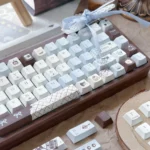 Artistic close-up of Sea Salt Choco Keycaps set, revealing unique ocean-inspired PBT dye-sublimated design. Gentle sea hues and delicate accents evoke a sea inspired.