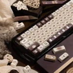 Detailed view of the whimsical Siamese Cat Cafe PBT Dye-Sub keycaps set, showcasing adorable cats and cozy coffee elements from a unique angle for mechanical keyboard.