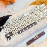 Adorable Siamese Cat Cafe PBT Dye-Sub Keycaps Set, viewed from multiple angles. Showcases whimsical Siamese cats, cozy coffee elements, and warm artistic design.