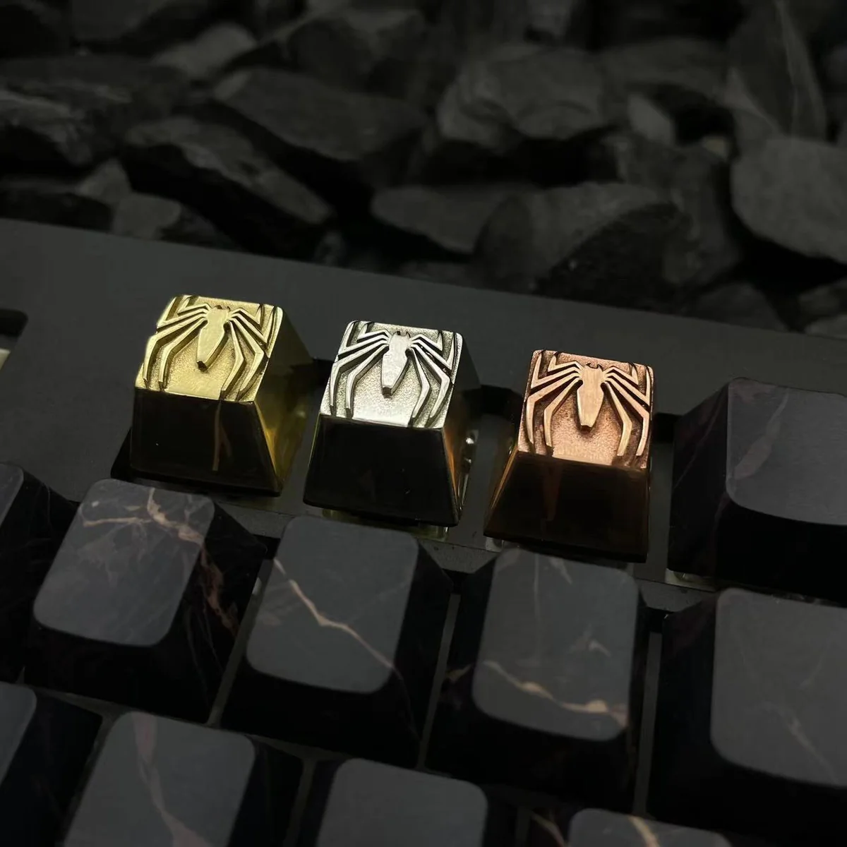 Premium pure copper Spider-Man logo keycap, showcasing intricate metallic details and a vintage patina finish. An iconic artisan collectible.
