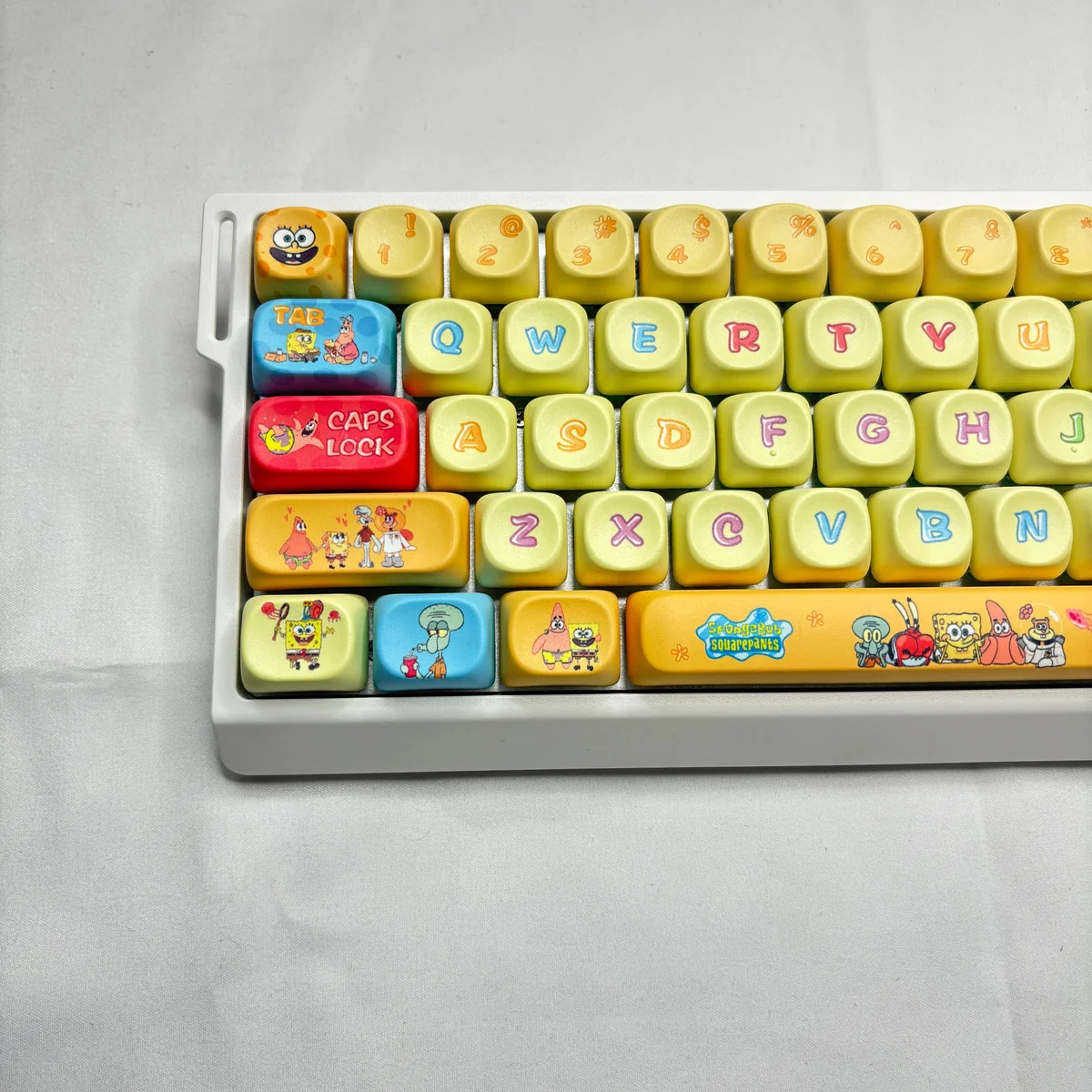 Vibrant SpongeBob PBT Dye-Sub MOA keycap set, showcasing iconic characters and Bikini Bottom scenes from all angles. Dive into fun!