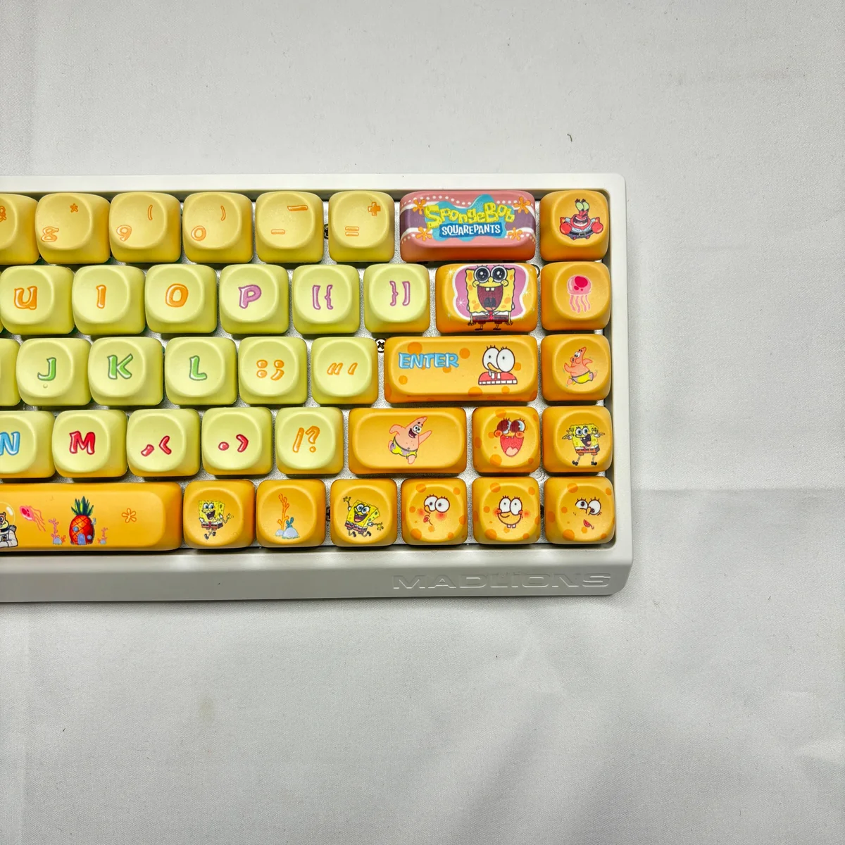 Vibrant SpongeBob PBT Dye-Sub MOA Keycap Set from multiple angles, highlighting iconic characters and playful Bikini Bottom scenes. Dive into fun!