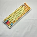 Playful SpongeBob PBT Dye-Sub MOA Keycap Set, featuring iconic characters and vibrant Bikini Bottom scenes. Explore various quality PBT keycaps.