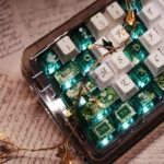 Artistic gallery of Spring Song FC Height PBT & PC keycaps set, showcasing vibrant spring pastel hues and delicate nature motifs from multiple angles.