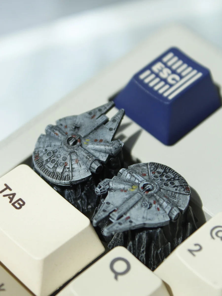 An array of iconic Star Wars resin artisan keycaps displayed from various angles, revealing the intricate details of legendary starships meticulously.