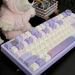 Dreamy Starry Sky Keycaps set in celestial PBT dye-sub, showcasing mystical swirling nebulae and distant stars from an artistic angle.