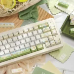 Authentic Sumikko Gurashi PBT Dye-Sub keycaps set displayed from multiple playful angles, highlighting the charming pastel characters for a whimsical keyboard.