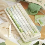 Product gallery view of authentic Sumikko Gurashi PBT Dye-Sub keycaps set, featuring charming pastel characters from various angles, bringing whimsy.