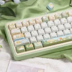 Explore the whimsical Sumikko Gurashi keycaps PBT dye-sub set from multiple angles, revealing charming pastel characters and authentic detailing.