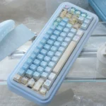 Angled view of the Whimsical Summer Kitty PBT Dye-Sub Keycap Set, showcasing bright, playful cat illustrations and subtle transparent details.