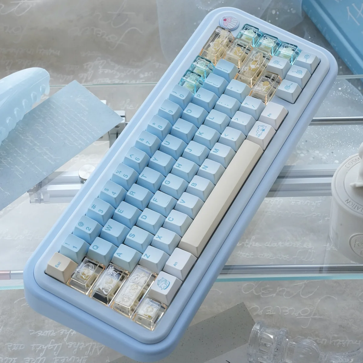 Angled view of the Whimsical Summer Kitty PBT Dye-Sub Keycap Set, showcasing bright, playful cat illustrations and subtle transparent details.