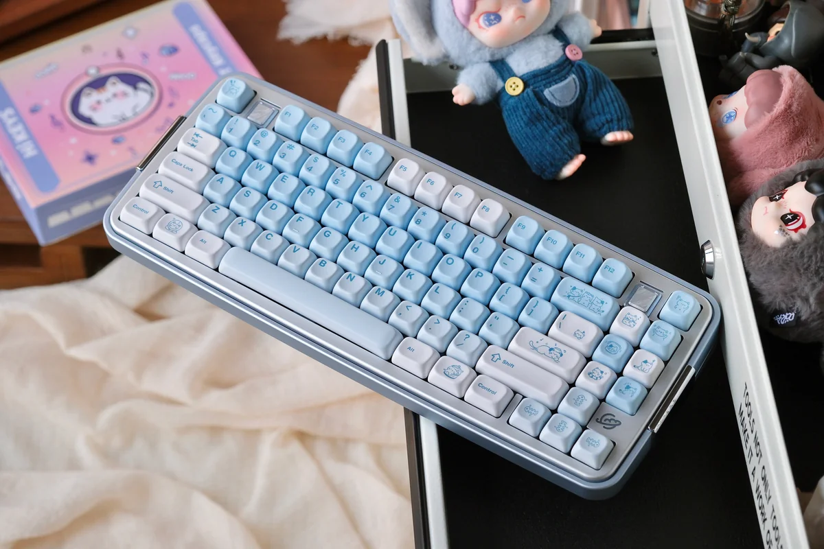 Close-up of the Whimsical Summer Kitty PBT Dye-Sub Keycap Set, showcasing a playful cat design with bright, transparent accents on a durable PBT keycap.